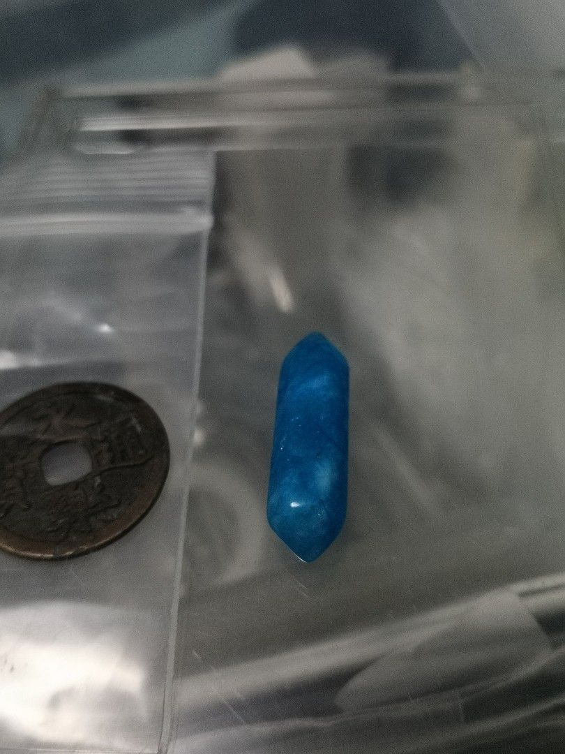 light blue stone with white lines
