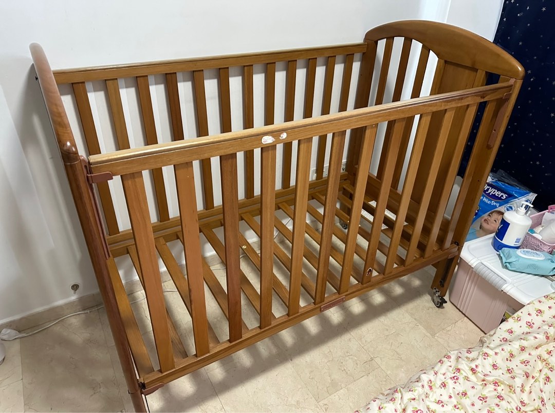 Solid wood baby cot with wheels, Babies & Kids, Baby Nursery & Kids