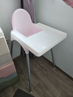 Pink Ikea baby chair with tray