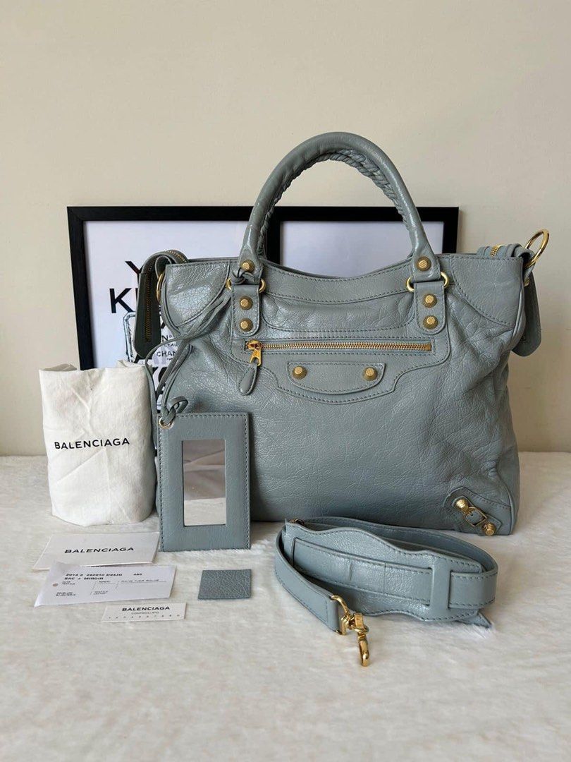 Balenciaga Giant Velo Bag (Category: Luxury Bags & Wallets) located in Manila. Submitted by bagislifeshop (Listing ID 1228022179, Image 1). Description: ▪️Balenciaga Giant Velo Bag▪️ ☑️Available in Pampanga ✅Condition: 8.8/10 ✅Material: Lambskin leather ✅Colour: Light blue in GHW ✅Size: 30cm x W: 34cm x D: 10cm ✅Inclusions: Dustbag, mirror, leather swatch, cards and strap .