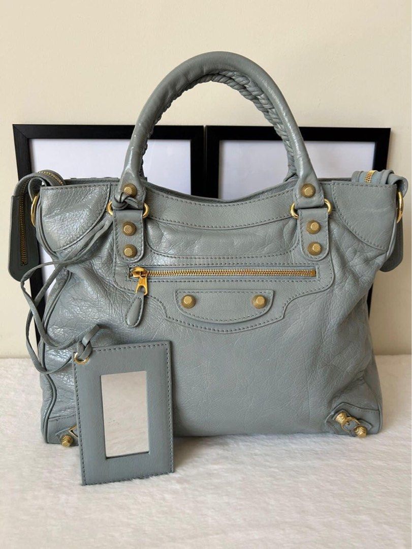 Balenciaga Giant Velo Bag (Category: Luxury Bags & Wallets) located in Manila. Submitted by bagislifeshop (Listing ID 1228022179, Image 2). Description: ▪️Balenciaga Giant Velo Bag▪️ ☑️Available in Pampanga ✅Condition: 8.8/10 ✅Material: Lambskin leather ✅Colour: Light blue in GHW ✅Size: 30cm x W: 34cm x D: 10cm ✅Inclusions: Dustbag, mirror, leather swatch, cards and strap .