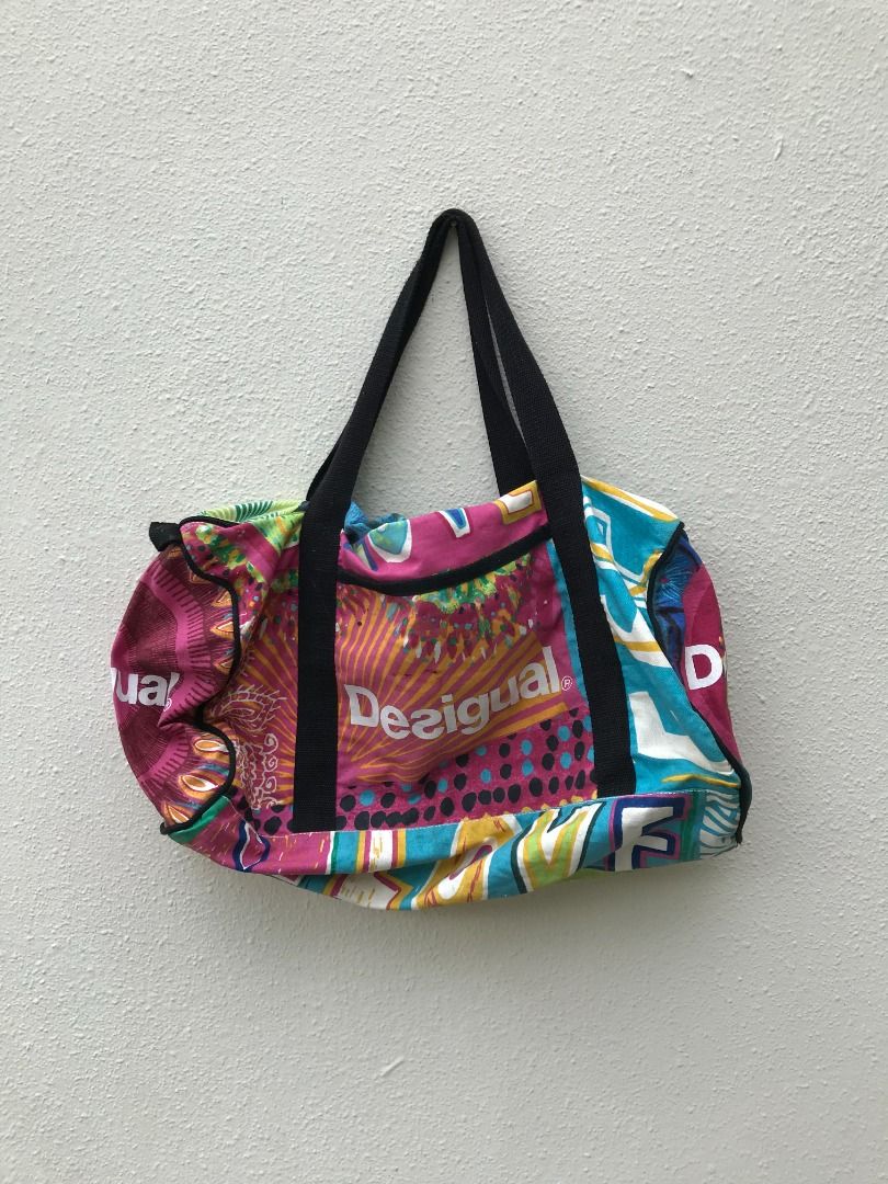 Desigual beach bag. In good condition. Zippers working and no tear but got slight stain