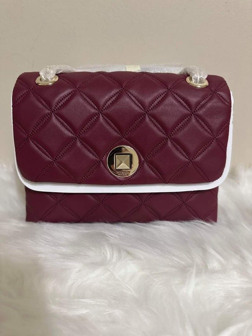 Kate Spade Natalia Smooth Quilted Leather (Category: Luxury Bags & Wallets) located in Dagupan City. Submitted by mrsrraga (Listing ID 1227911180, Image 1). Description: ✅Guaranteed 💯 Authentic from Canada Color: Blackberry MOP: Gcash only DETAILS 6.5''h x 8.7''w x 3.1''d strap drop: 22" quilted leather pale gold hardware on hardware logo two way spade jacquard lining interior: back slip pocket flap with turn lock closure Note: Price is Firm Dus