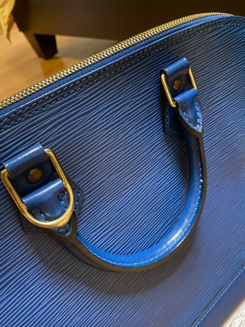 Louis Vuitton Alma Epi Blue Bag (Category: Luxury Bags & Wallets) located in Mandaluyong City. Submitted by peanutsola (Listing ID 1227960911, Image 2). Description: Still in excellent condition as seen on photo. No damage/defects whatsoever. Well taken care of. Can be viewed personally in our store before purchase, just msg us ahead of time:) 32 x 25 x 16 cm (Length x height x width ).