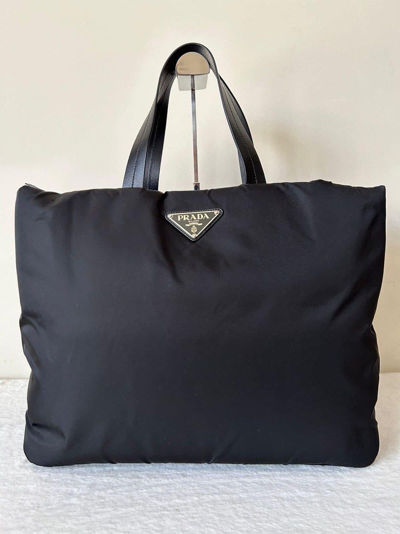Prada Large Tote 2-way Bag (Category: Luxury Bags & Wallets) located in Manila. Submitted by bagislifeshop (Listing ID 1228024578, Image 2). Description: ▪️Prada Large Tote 2-way Bag▪️ ☑️Available in Pampanga ✅Condition: 9/10 ✅Material: Nylon ✅Colour: Black ✅Size: 40x32x17 cm ✅Inclusions: Dustbags, cards and strap .