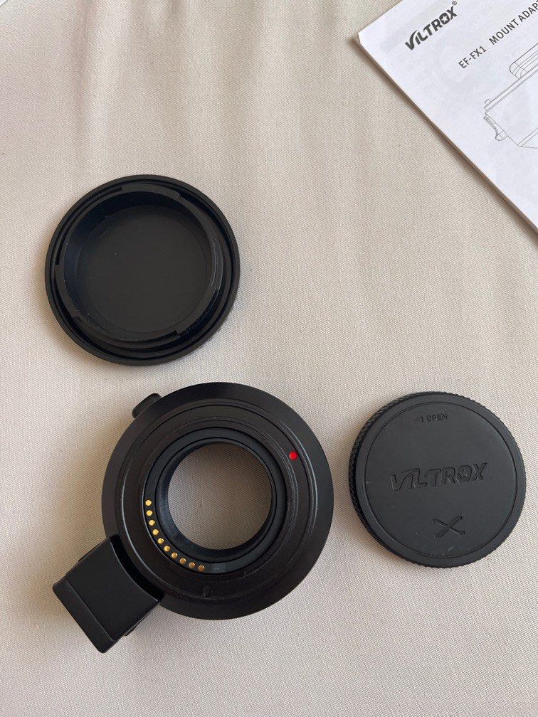 Viltrox mount adapter for fuji-X mount (Category: Lens & Kits) located in Cebu City. Submitted by bkaye22 (Listing ID 1227909868, Image 3). Description: Voltrox EF-FX1 Specs Compatible lenses-Canon EF/EF-S series lenses Compatible camera- Fuji X-Mount mirrorless focus mode : Auto focus tripod socket : Cu1/4” x 1 Firmware upgrade: USB upgrade port Diameter & Length : 67mm x 31mm Weight: Aprprox. 142g Front cap : Camera cover Rear cap: Lens dust ca