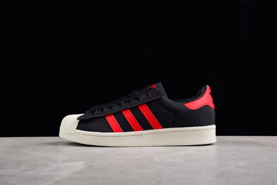 White shoes with black online stripes