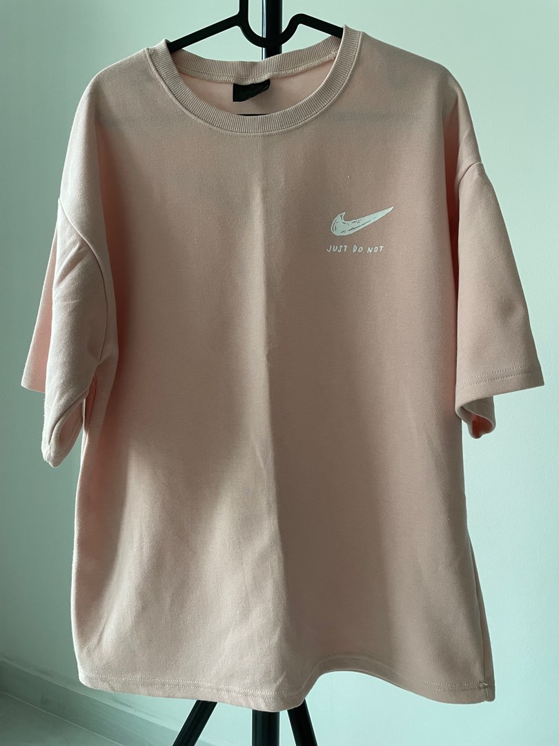 pink black and white nike shirt