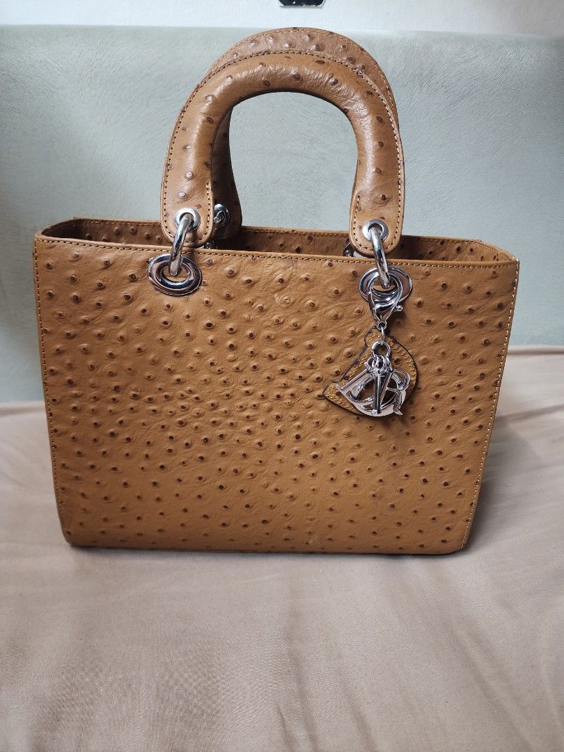 Lady dior (Category: Luxury Bags & Wallets) located in Manila. Submitted by luxe.allure (Listing ID 1228334623, Image 1). Description: Vintage lady dior mock ostrich leather size: 30cm Bag only, no strap. No brand. Issue: The clasp is broken but not noticeable. Refer to last pic. Rfs: decluttering no to low ballers.