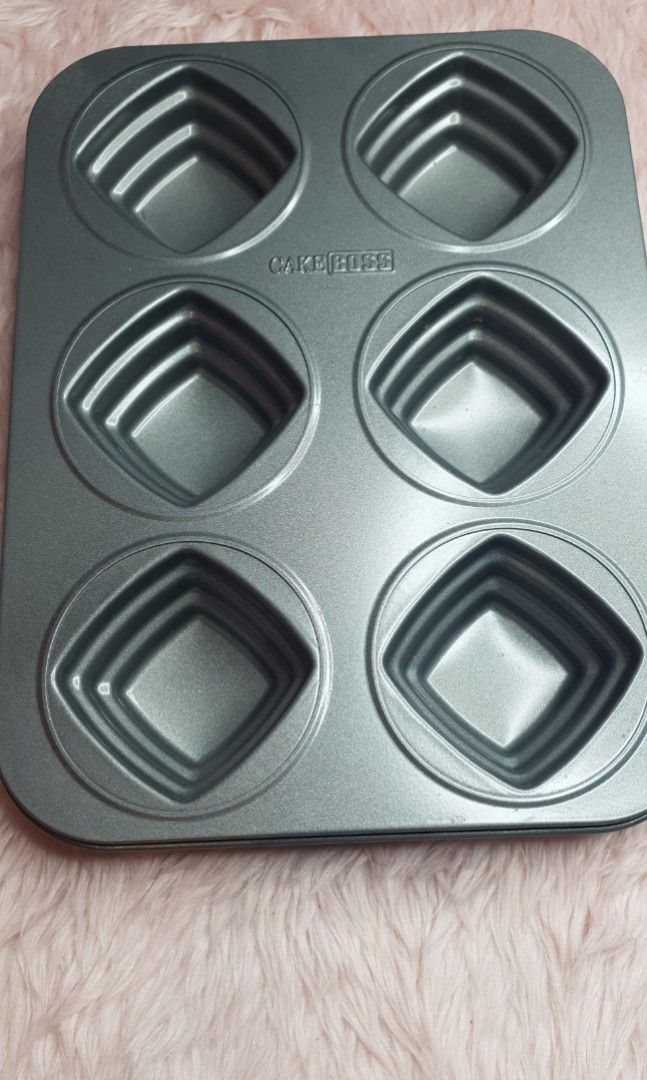 CAKE BOSS Non stick Mini Cake Baking Tray (Category: Bakeware) located in Santa Rosa. Submitted by fairygalesclothestation25 (Listing ID 1228514595, Image 1). Description: used once authentic Cake boss baking tray from US.
