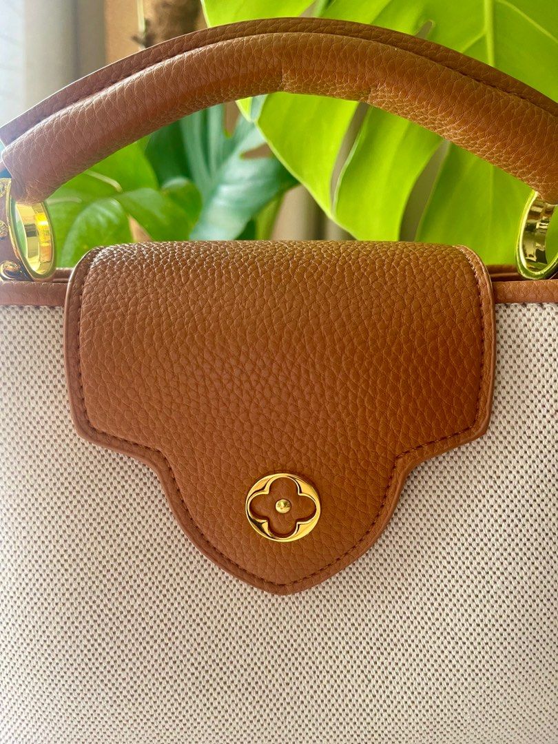 LV Mini Capucines in Canvas and Grain Leather (Category: Luxury Bags & Wallets) located in Mandaluyong City. Submitted by iamprettywow (Listing ID 1192697023, Image 2). Description: For Sake or Swap. Pm your offer. What you see is what you get Used one time for pictorial Very pretty in actual 9/10 Condition. It comes with dustbah only Pm me for more details. FREE SHIPPING For our safety reason I can only meet up at : SM LIGHT RESIDENCES or SHERID