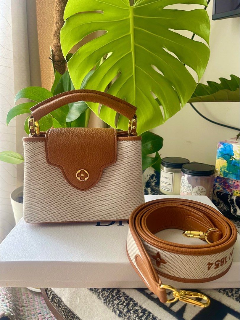LV Mini Capucines in Canvas and Grain Leather (Category: Luxury Bags & Wallets) located in Mandaluyong City. Submitted by iamprettywow (Listing ID 1192697023, Image 1). Description: For Sake or Swap. Pm your offer. What you see is what you get Used one time for pictorial Very pretty in actual 9/10 Condition. It comes with dustbah only Pm me for more details. FREE SHIPPING For our safety reason I can only meet up at : SM LIGHT RESIDENCES or SHERID