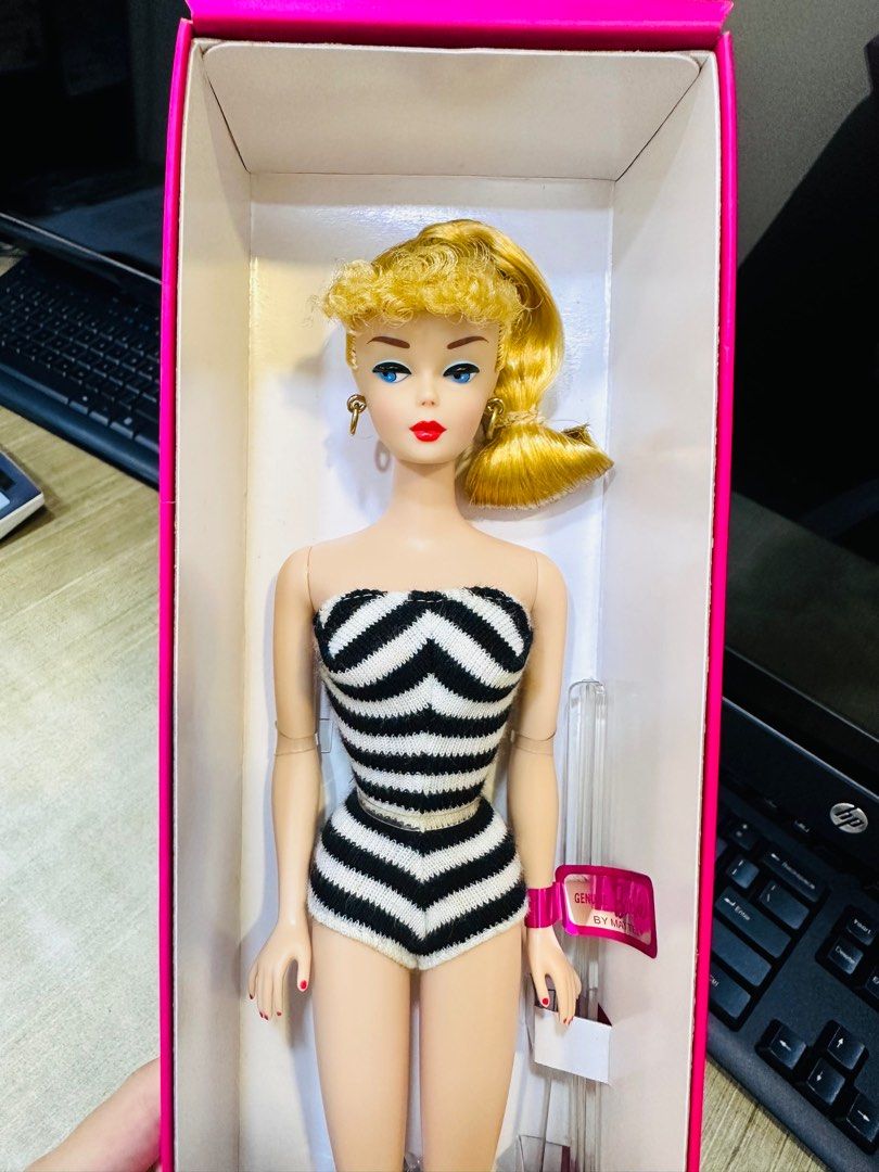 Barbie in black top and white bathing suit