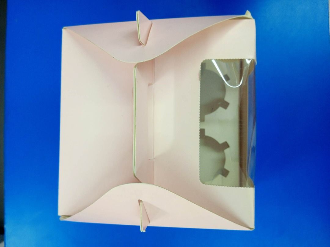 Cupcake Box 4 holes, with handle (pink) (GPPB 40) (Category: Storage Boxes & Baskets) located in Caloocan City. Submitted by glasspakph (Listing ID 1228613044, Image 2). Description: Size: Height:11cm Length:15.5cm Width:15.5cm Cake Box is a great way to hold your to go cakes, pies, muffins & cupcakes! Order a box a little larger than your cake to allow room for decorating. This 1 piece box is easy to use as you just fold the corners and lock the
