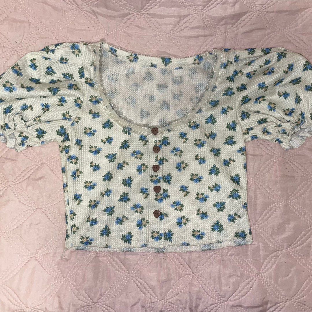Flower Croptop (Category: Others Tops) located in Paranaque City. Submitted by a_declutterss (Listing ID 1228861265, Image 3). Description: ❀ fits xs-s ❀ used once ❀ has garter sa neck part and sleeves ❀ v cute detailed design esp d heart buttons !! ❀ cute for casual ❀ Gcash only 💙.