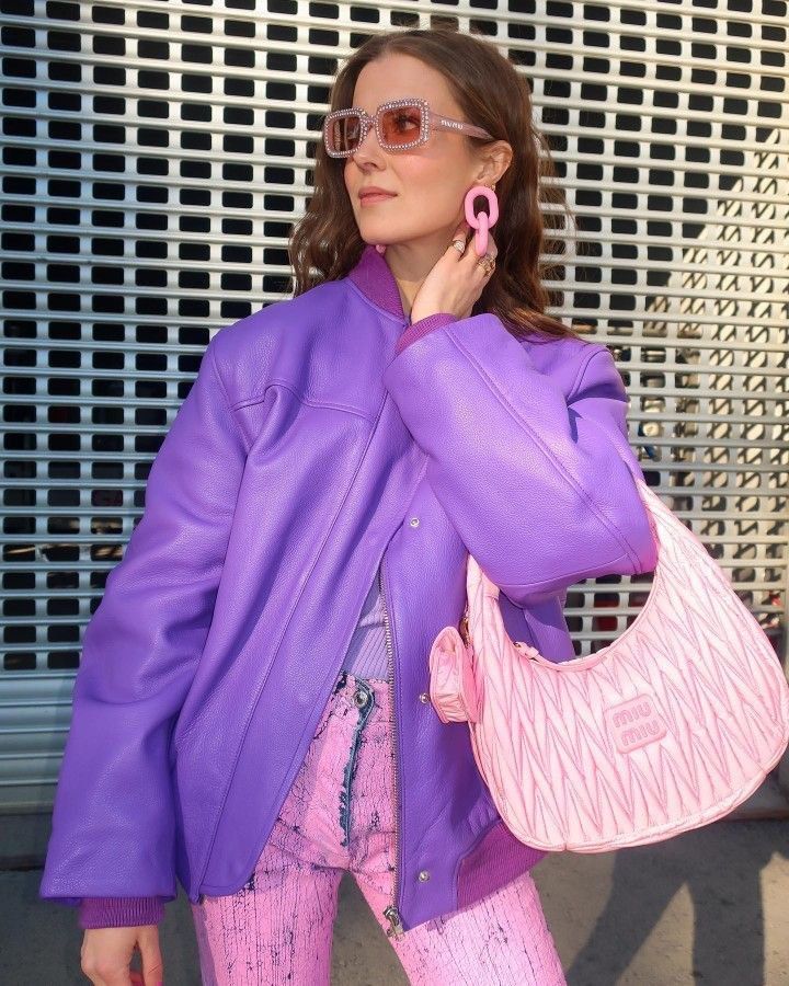 Milan, Italy - February, 25, 2022: woman wears pink Miu Miu Wander  Matelasse hobo bag in regenerated nylon Stock Photo - Alamy