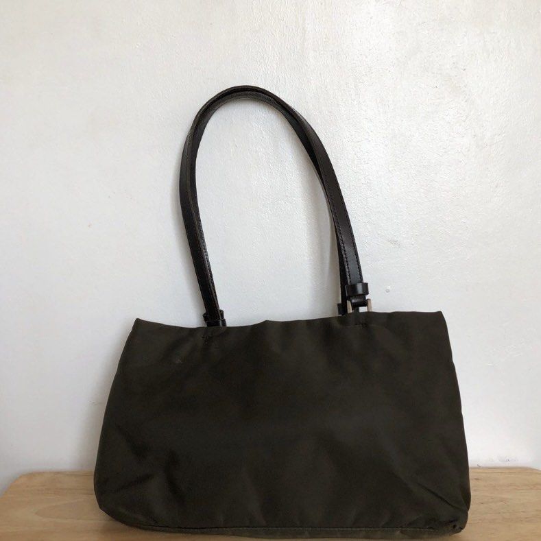 Prada Nylon Bag (Category: Luxury Bags & Wallets) located in Las Pinas. Submitted by decluttxrstudios (Listing ID 1228835047, Image 2). Description: middle zipper needs repair (last photo) signs of usage .