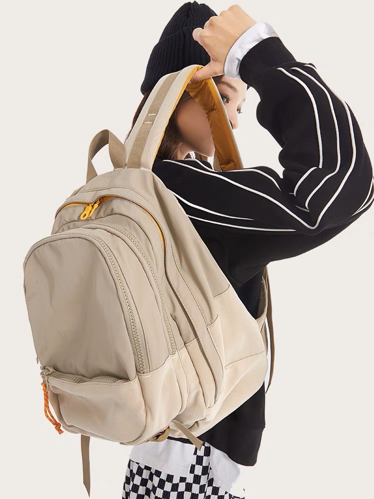 Beige Backpack with multiple zippers on Carousell