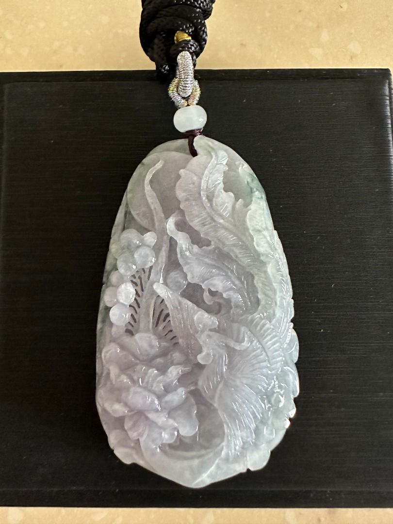 🏵️ Myanmar Type A Natural Purple Green Jade Phoenix Pendant 凤凰翡翠 (Category: Necklaces) located in Singapore. Submitted by starariez.atelier (Listing ID 1228937864, Image 2). Description: Genuine Grade "A" Jade Pendant. Good Grade. Nice Lavender and Green color, Very good craving. This is a very nice piece and the size is thick. Comes with Gift Box 69.4mm x 42.4mm x 12.8mm Message me if you need more pictures of the items. Comes with Certificate.