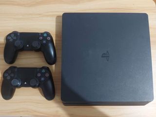 Playstation 4 (PS4) Slim 500GB console + games (sold separately)
