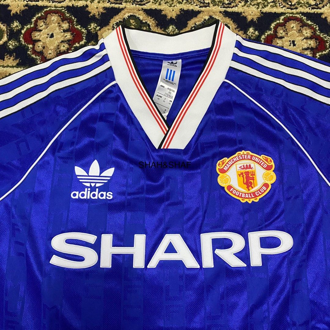Man utd best sale retro blue shirt
