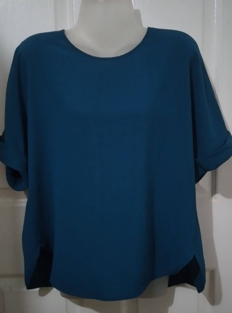 Uniqlo teal blouse/top L (Category: Blouses) located in Antipolo. Submitted by cychiyo (Listing ID 1229059681, Image 1). Description: BNWOT Uniqlo teal blouse /top Large on tag cuffed sleeves shop-bought new at Uniqlo UP Town Center used once for half a day; practically new no issues at all already washed and clean, ready to wear kept well last price posted; please offer price listed. thanks.
