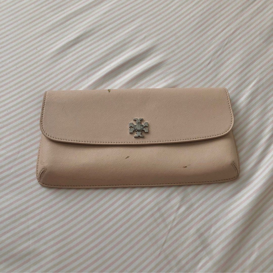 Authentic Tory Burch Clutch Nude Beige Leather Silver Logo Hardware (Category: Luxury Bags & Wallets) located in Quezon City. Submitted by selling.my.closet (Listing ID 1228287762, Image 1). Description: Paint coming off due to storage and heat, but can be repaired.
