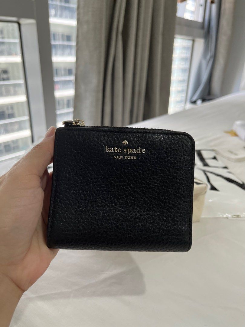 Kate Spade Bifold Wallet (Category: Wallets & Card holders) located in Taguig. Submitted by joysprelovedstuff (Listing ID 1229124052, Image 1). Description: Not using anymore Signs of usage only no major flaws No inclusion wallet only Guaranteed authentic money back if proven fake.