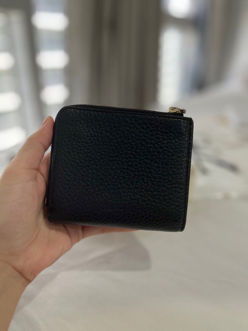 Kate Spade Bifold Wallet (Category: Wallets & Card holders) located in Taguig. Submitted by joysprelovedstuff (Listing ID 1229124052, Image 2). Description: Not using anymore Signs of usage only no major flaws No inclusion wallet only Guaranteed authentic money back if proven fake.