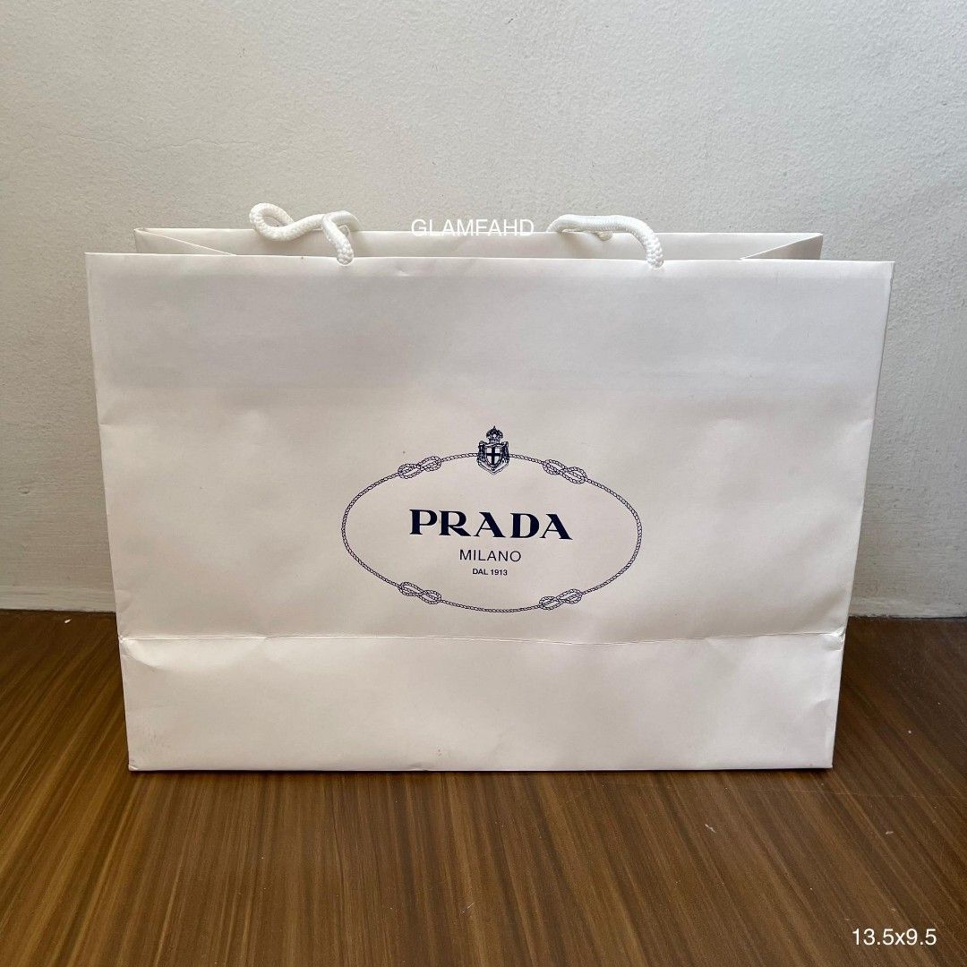Pre Owned Authentic PRADA Paperbag (Category: Luxury Bags & Wallets) located in Paranaque City. Submitted by Glamfahd (Listing ID 1229239082, Image 1). Description: PRE OWNED AUTHENTIC PRADA PAPERBAG Features Size 13.5 x 9.5 inches Condition With marks/dirt Please see photos to appreciate .