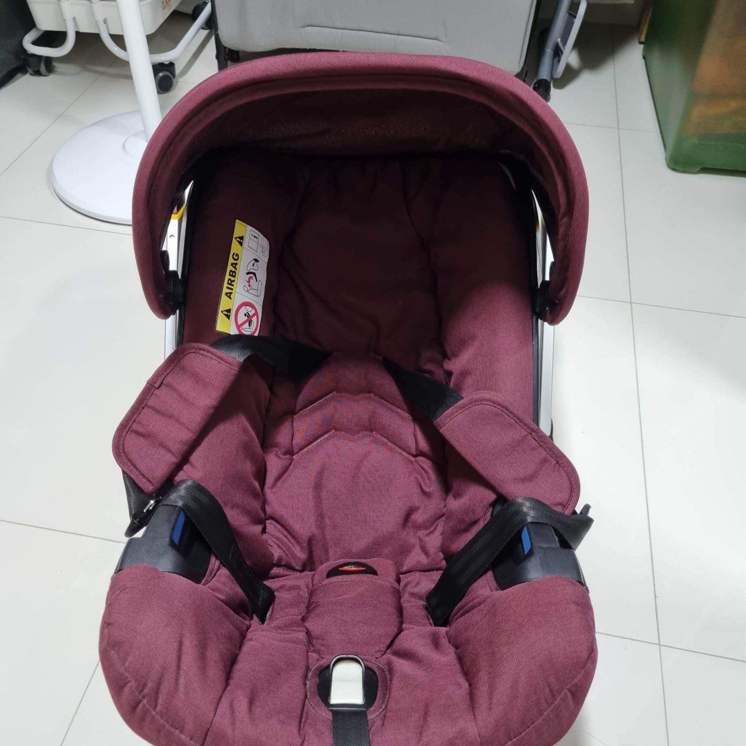 Maroon car shop seat and stroller