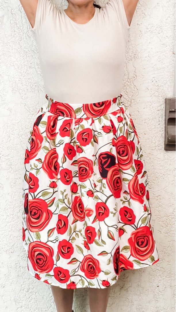 Floral Midi Skirt (Category: Skirts) located in Quezon City. Submitted by mommake (Listing ID 1229409819, Image 2). Description: - Such good quality, structured material not flowy, midi length - Beauty and the Beast (enchanted rose) feels hehe - waist/hips: 12-13 inches (laid flat, barely any stretch), length: 23 inches - Shipping c/of buyer, item can be shipped from QC, Ortigas, or Makati, can also ship via Flash/Gogo Express, no Shopee checkout