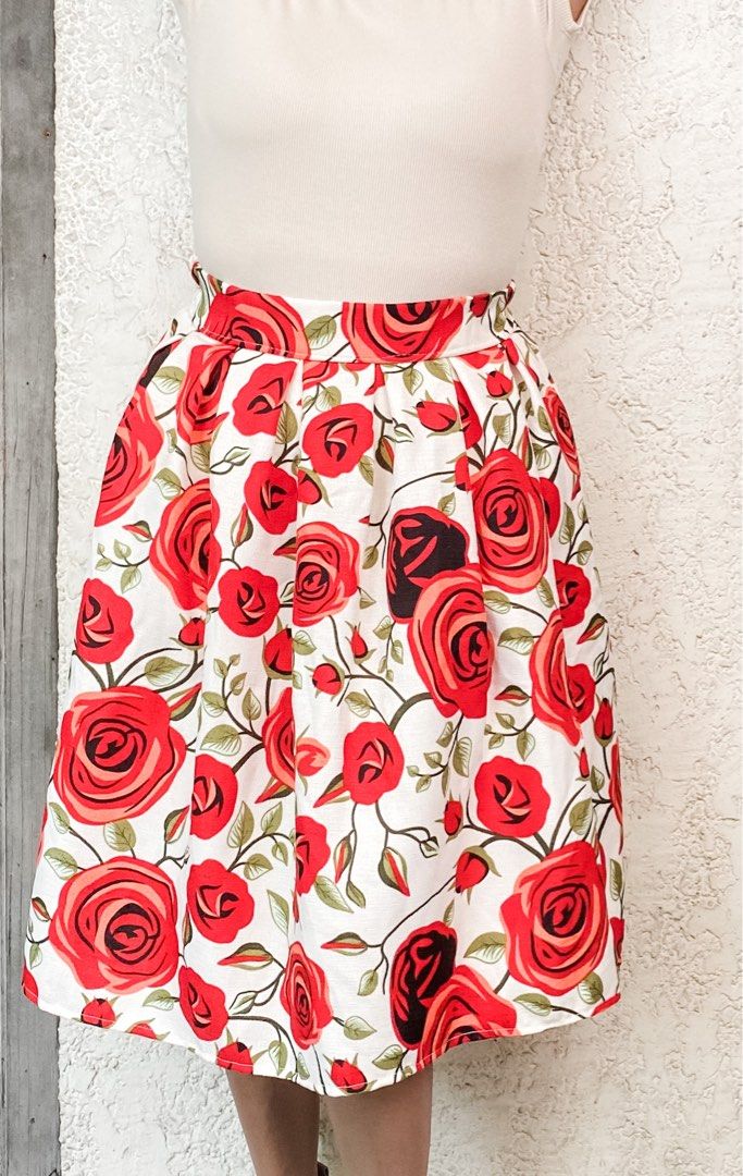 Floral Midi Skirt (Category: Skirts) located in Quezon City. Submitted by mommake (Listing ID 1229409819, Image 1). Description: - Such good quality, structured material not flowy, midi length - Beauty and the Beast (enchanted rose) feels hehe - waist/hips: 12-13 inches (laid flat, barely any stretch), length: 23 inches - Shipping c/of buyer, item can be shipped from QC, Ortigas, or Makati, can also ship via Flash/Gogo Express, no Shopee checkout