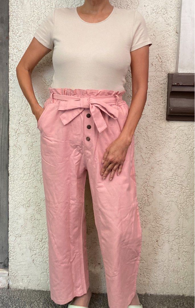 Pink Office Trousers (Category: Other Bottoms) located in Quezon City. Submitted by mommake (Listing ID 1229414625, Image 1). Description: - flattering! - Waist (laid flat): 12.5 inches, comfortably stretchable until 15 inches, 35 inches in length - Shipping c/of buyer, item can be shipped from QC, Ortigas, or Makati, can also ship via Flash/Gogo Express, no Shopee checkout Model’s dimensions: Bust: 34 inches (34B) Waist: 28 inches Hips: 35 inche