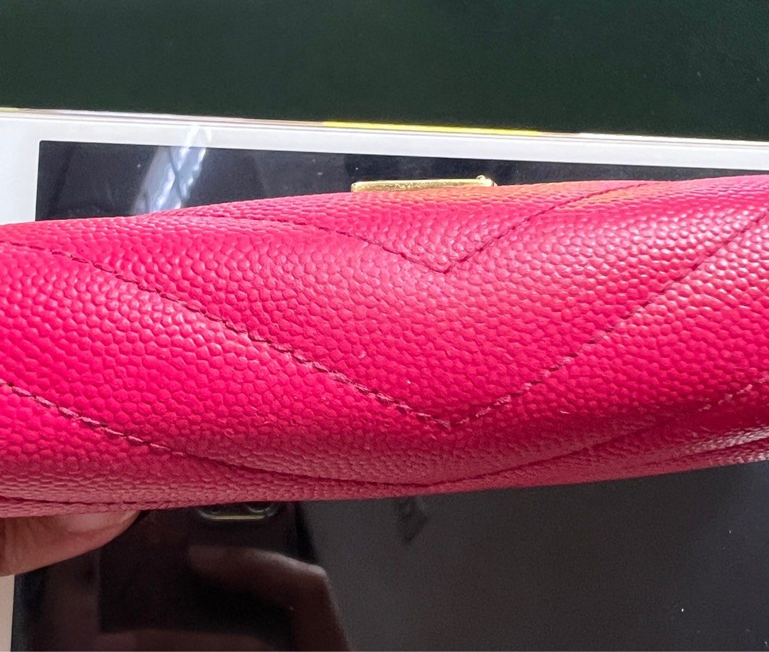 YSL Zip wallet (Category: Luxury Bags & Wallets) located in Cainta. Submitted by emille627 (Listing ID 1229290212, Image 3). Description: Authentic YSL zip wallet Caviar leather Pink color No box Flaw: sticky outside leather (due to leather cleaner) Rubs on edges Inside is excellent condition.