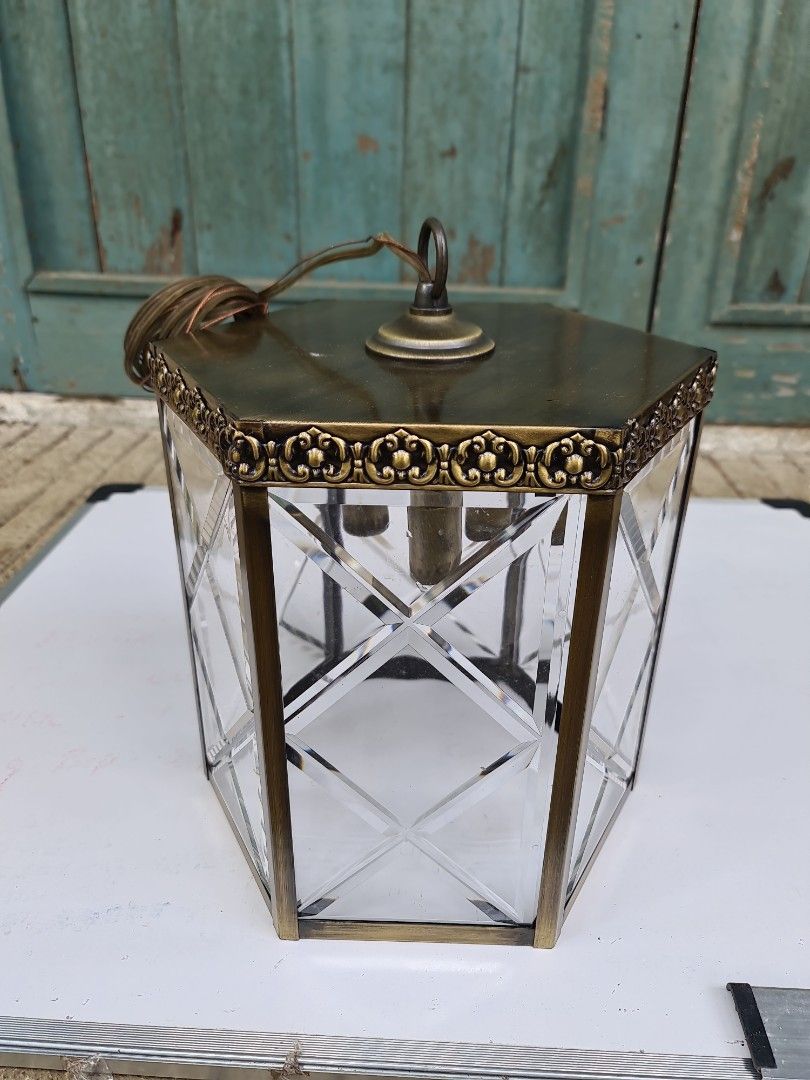Hanging lamp/Drop light (Category: Lighting) located in Makati City. Submitted by harvesting_game (Listing ID 1224666208, Image 1). Description: Antique brass finish - Hanging lamp/Drop light. Complete accessories. All glass panes intact. 1 piece only Never installed but has a slight discoloration at the bottom due to storage issues - this may be painted over.. Great for the entrance way!.