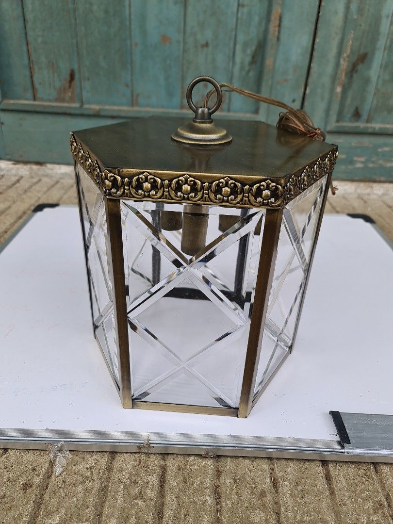 Hanging lamp/Drop light (Category: Lighting) located in Makati City. Submitted by harvesting_game (Listing ID 1224666208, Image 2). Description: Antique brass finish - Hanging lamp/Drop light. Complete accessories. All glass panes intact. 1 piece only Never installed but has a slight discoloration at the bottom due to storage issues - this may be painted over.. Great for the entrance way!.