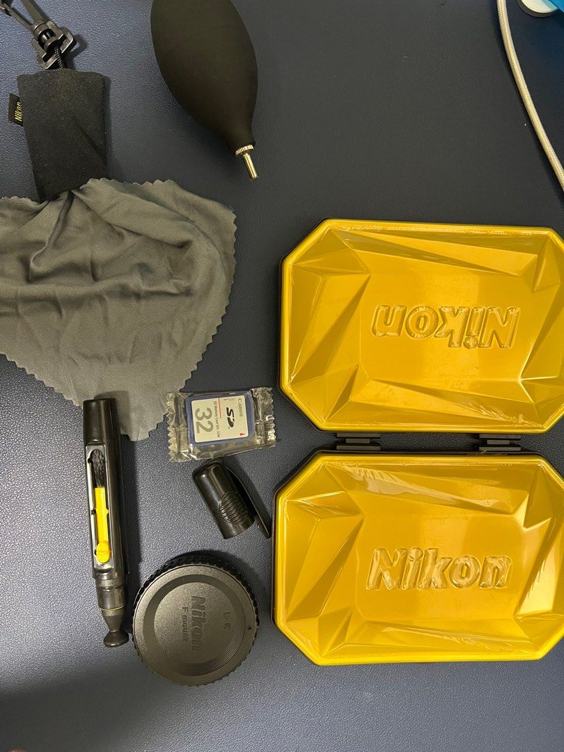Nikon Cleaning Kit + Nikon Lens Cap + Canon Sd card, Photography