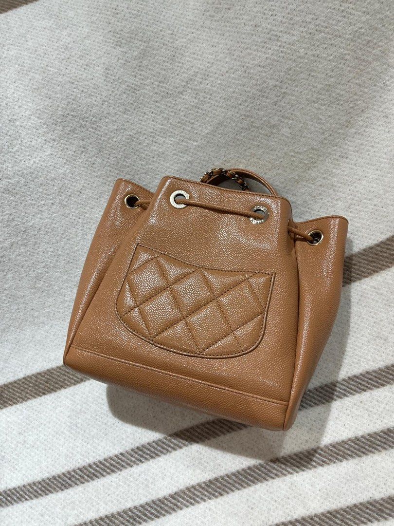 Chanel bucket bag with front pocket in dark beige with gold