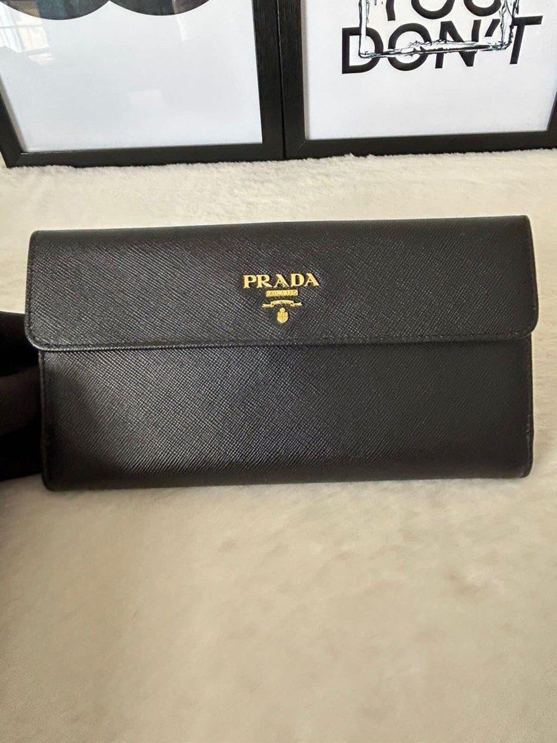 Prada Long Flap Wallet (Category: Luxury Bags & Wallets) located in Manila. Submitted by bagislifeshop (Listing ID 1224728093, Image 2). Description: ▪️Prada Long Flap Wallet▪️ ☑️Available in Pampanga ✅Condition: 8.8/10 ✅Material: Saffiano leather ✅Colour: Black in GHW ✅Size: 7.6 “ L, 1 “ W, 4 “ H ✅Inclusions: Cards and box .