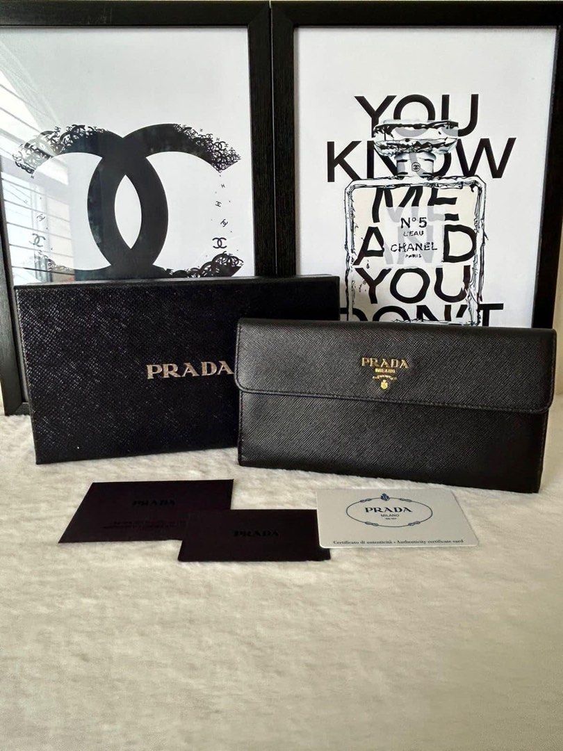 Prada Long Flap Wallet (Category: Luxury Bags & Wallets) located in Manila. Submitted by bagislifeshop (Listing ID 1224728093, Image 1). Description: ▪️Prada Long Flap Wallet▪️ ☑️Available in Pampanga ✅Condition: 8.8/10 ✅Material: Saffiano leather ✅Colour: Black in GHW ✅Size: 7.6 “ L, 1 “ W, 4 “ H ✅Inclusions: Cards and box .