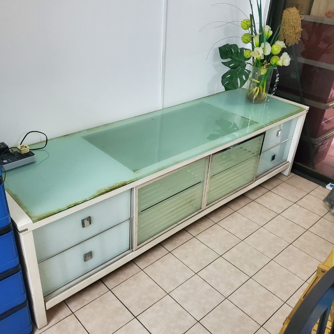 TV Glass top almost 7 feet wide, w 4 drawers, 3 inside