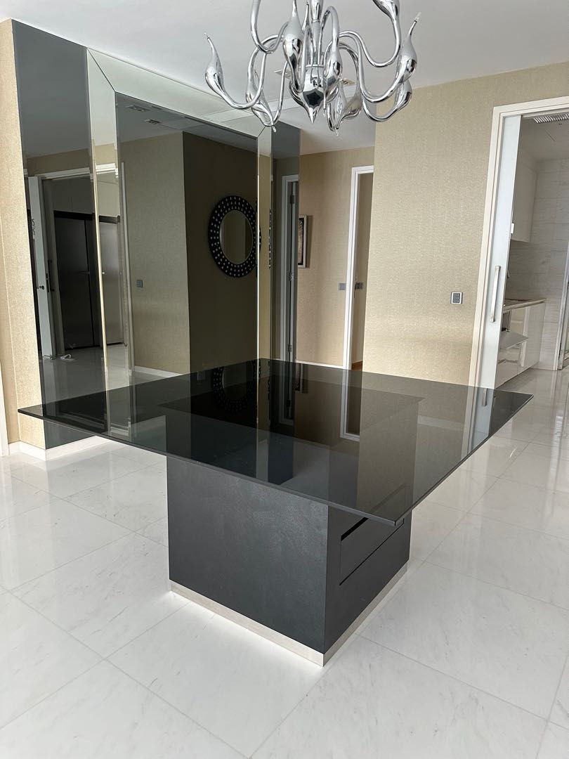 Dining Table (Category: Tables & Sets) located in Singapore. Submitted by laserman8888 (Listing ID 1224976104, Image 2). Description: A custom-made dining table with tempered glass top, tinted and attached to a wooden base with 2 drawers on opposing sides. Dimensions: 140 x 140 x H75 cm Base 70 x 70cm Excellent condition Good for 9-12 people Please arrange for your own transportation. .
