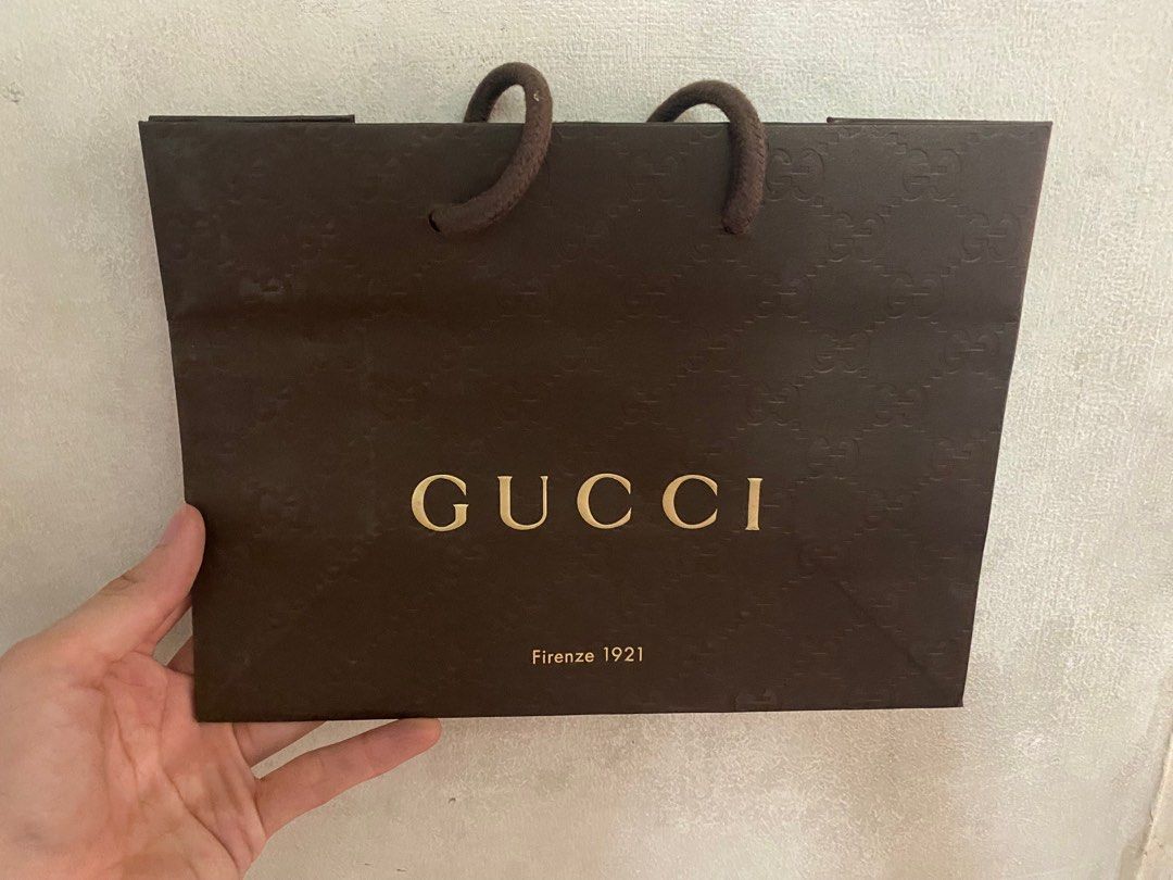Gucci small paper bag (Category: Luxury Bags & Wallets) located in Caloocan City. Submitted by michikeng (Listing ID 1225149290, Image 1). Description: Small size Gucci paper bag watch belt wallet Other paper bag brands avaialable.