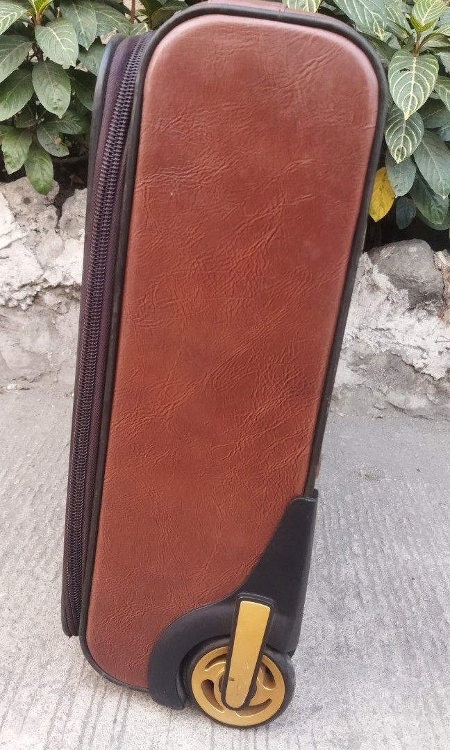 leather trolley bag 2 wheels (Category: Luxury Bags & Wallets) located in Malabon City. Submitted by immortalpicker (Listing ID 1225248012, Image 3). Description: Brand= BAOSHIWEI Model= 2 wheels trolley bag Designs in hong Kong H= 18 3/4 inches L= 21 1/2 Inches W= 7 Inches Color = Brown Material = leather with 3 pockets 2nd hand with scratch No warranty If there's Damage or Issues they can be seen in the last pictures Price = 4,500 No swapping p