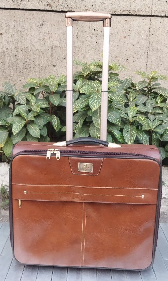 leather trolley bag 2 wheels (Category: Luxury Bags & Wallets) located in Malabon City. Submitted by immortalpicker (Listing ID 1225248012, Image 1). Description: Brand= BAOSHIWEI Model= 2 wheels trolley bag Designs in hong Kong H= 18 3/4 inches L= 21 1/2 Inches W= 7 Inches Color = Brown Material = leather with 3 pockets 2nd hand with scratch No warranty If there's Damage or Issues they can be seen in the last pictures Price = 4,500 No swapping p