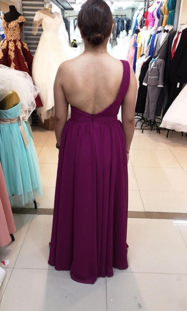 Backless One Shoulder - Evening Gown (Category: Evening dresses & gowns) located in Makati City. Submitted by declutteryu (Listing ID 1225462092, Image 1). Description: Used once during wedding - MOH dress Custome made, Brought at 3800.00 Material: Hi Multi Chiffon double skirt/over Soft Geena/with Soft Tulle in front with minimal bead works Condition: 10/10 Dry Cleaned before safe keeping Actual when worn photo Color - Mulberry (please see color