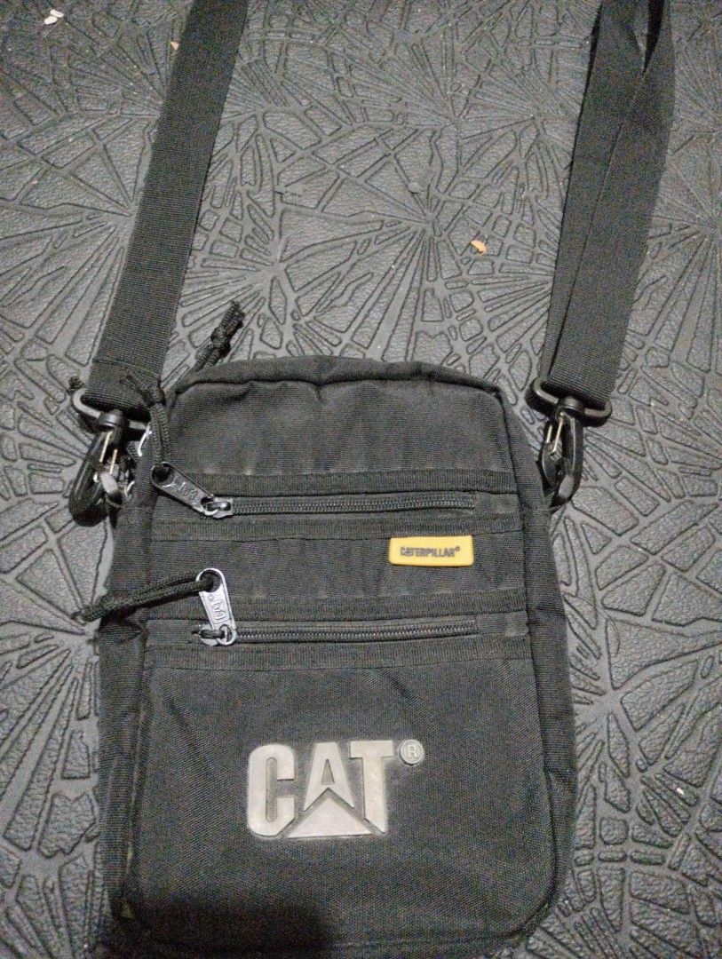 CAT Sling bag for Men (Category: Sling Bags) located in Tacurong. Submitted by acostaian (Listing ID 1225442422, Image 1). Description: For sale: Preloved CAT Sling Bag Reason for sale: I have bought new sling bag. Price: PM me for the price. CAT Bags👜 features： 🟡style:casual fashionable ⚫Applicable place:office party 🟤zipper:4zipper 🔴hardness:comfortable 🟣material:oxford cloth 🟢size:S:w15cm*t5cm*h21cm M: w16cm*t5cm*h24cm L:w19cm*t6cm*h26cm