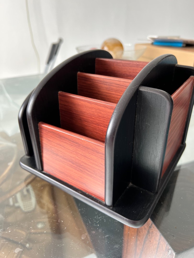 Rotatable remote control holder holds multiple remotes, Furniture