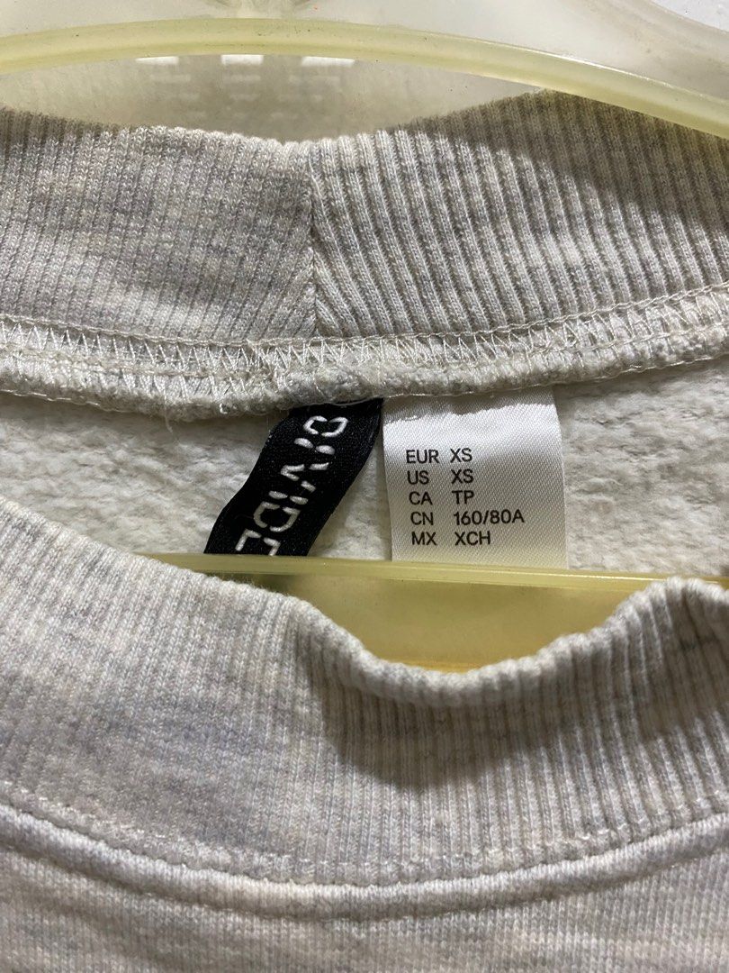 H&M grey emoji sweatshirt (Category: Coats, Jackets and Outerwear) located in Quezon City. Submitted by fergachoo (Listing ID 1225637897, Image 3). Description: 💟 Preloved H&M grey emoji sweatshirt 💟 Size XS 💟 not available in stores anymore 💟 has 1 tiny stain, will TRY to remove it before shipping! ⚠️ MOP: Gcash only ⚠️ MOD: Lalamove/GGX only .